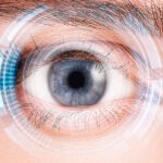 Security retina scanner on woman blue eye